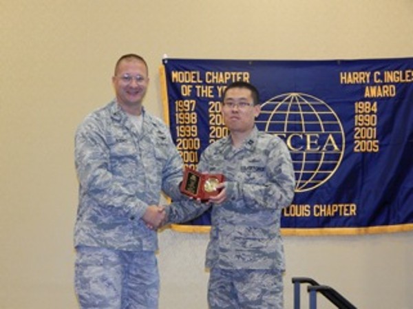 In October, Col. David Bosko, USAF (l), chapter president, presents the AFCEAN of the Month Award to Capt. Jichul Song, USAF.